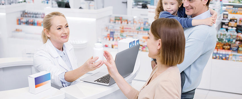 Pleased female pharmacist consulting woman