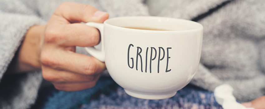 ill man and mug with word grippe, flu in french