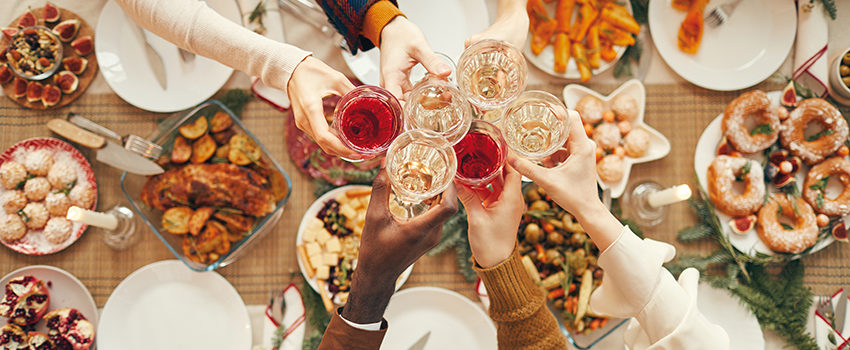 Celebration Toast over Festive Dinner Table